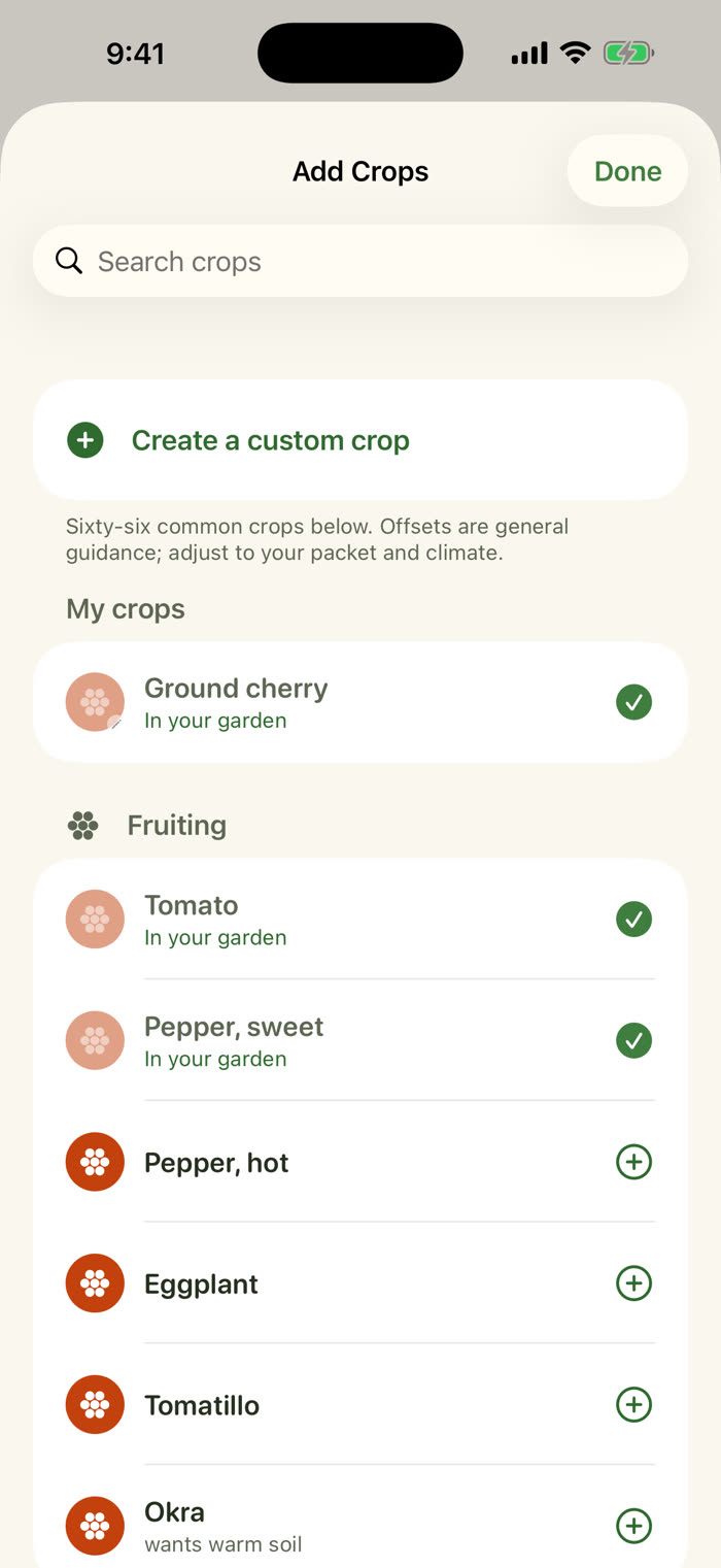 The Add Crops sheet with a search field and a Create a custom crop row at the top. My crops lists Ground cherry, Tomato and sweet pepper with checkmarks. Fruiting crops such as hot pepper, eggplant, tomatillo and okra follow, each with an add button.
